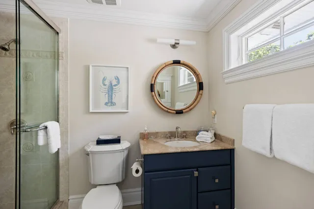 a living room with furniture a air conditioner and a table