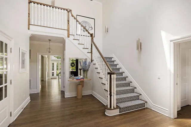 a living room with furniture ceiling fan and a rug