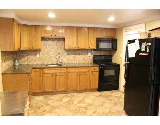 154 Darling Street Springfield, MA 01151 - Photo 5 of 17 a kitchen with stainless steel appliances granite countertop a refrigerator sink and cabinets