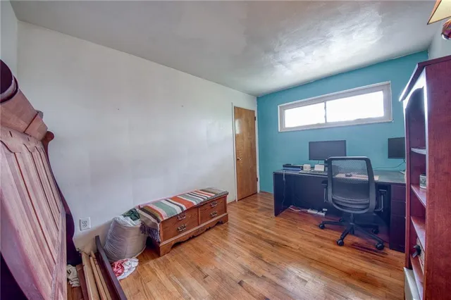 a living room with furniture rug and a window