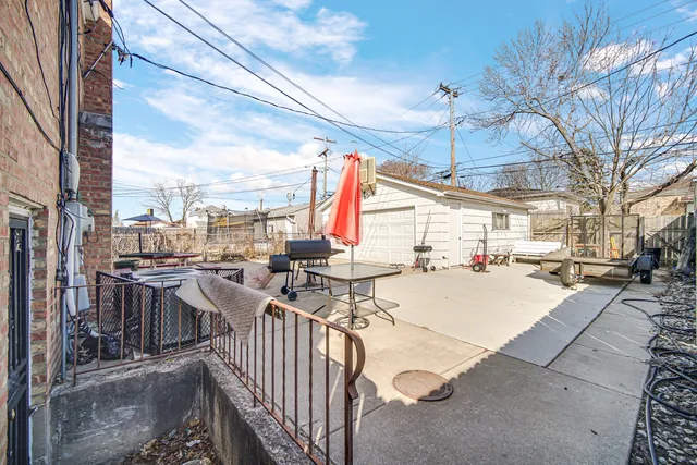 a view of a patio with couches near a barbeque