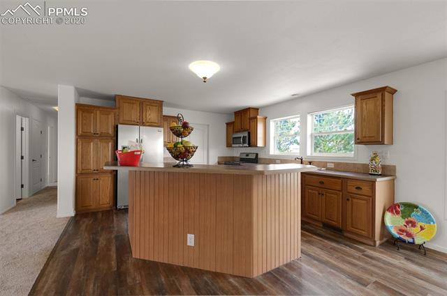 22750 Handle Road Calhan, CO 80808 - Photo 13 of 34 Kitchen with hallway view.