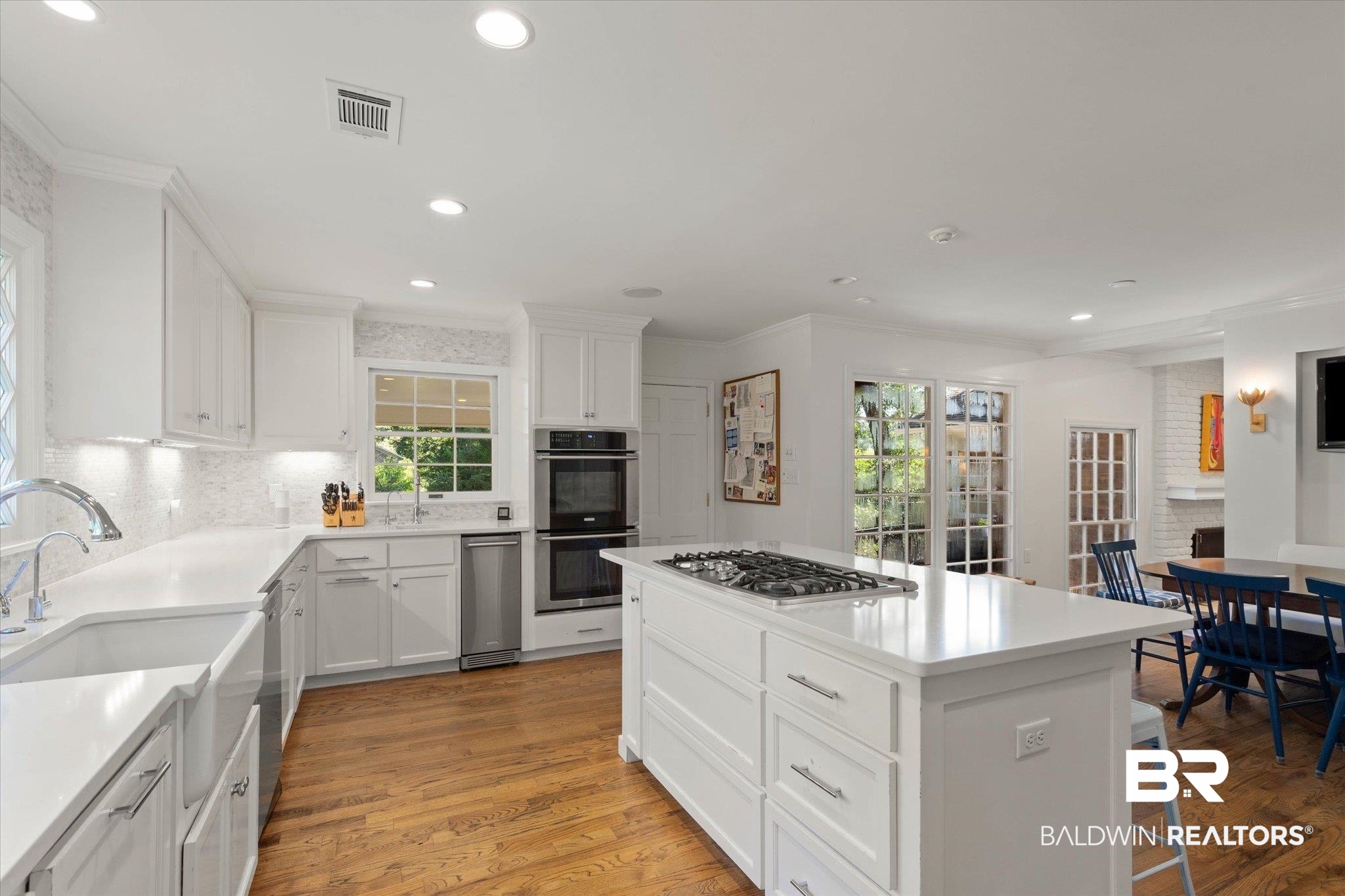 3612 Linden Lane Mobile, AL 36608 - Photo 16 of 42 Kitchen featuring ornamental molding, light wood finished floors, tasteful backsplash, healthy amount of natural light, and recessed lighting
