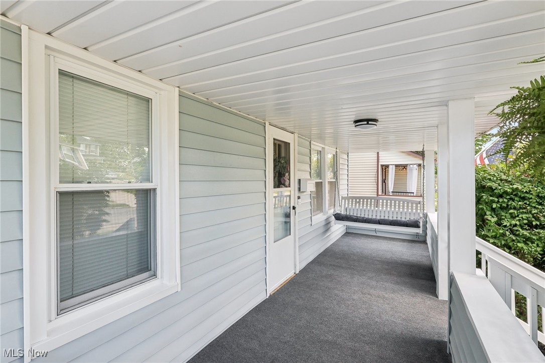 1567 Roselawn Road Cleveland, OH 44124 - Photo 16 of 29 View of porch with a porch swing