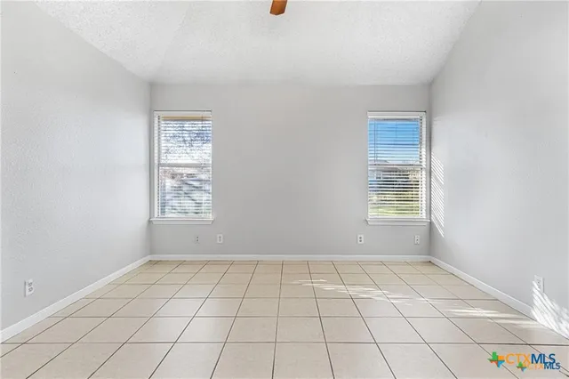 a view of an empty room and window