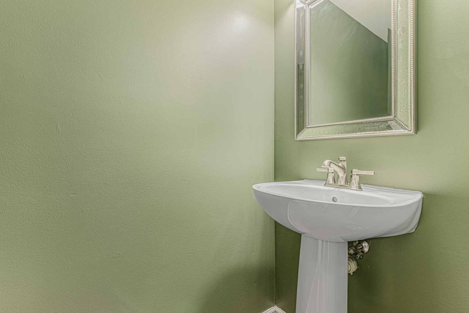 1516 Normantown Road Naperville, IL 60564 - Photo 17 of 20 a bathroom with a sink and a mirror