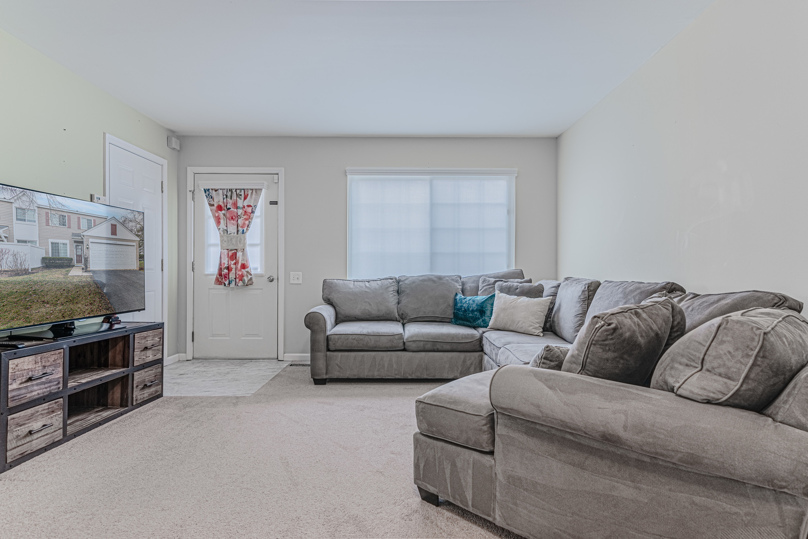 1516 Normantown Road Naperville, IL 60564 - Photo 3 of 20 a living room with furniture and a flat screen tv