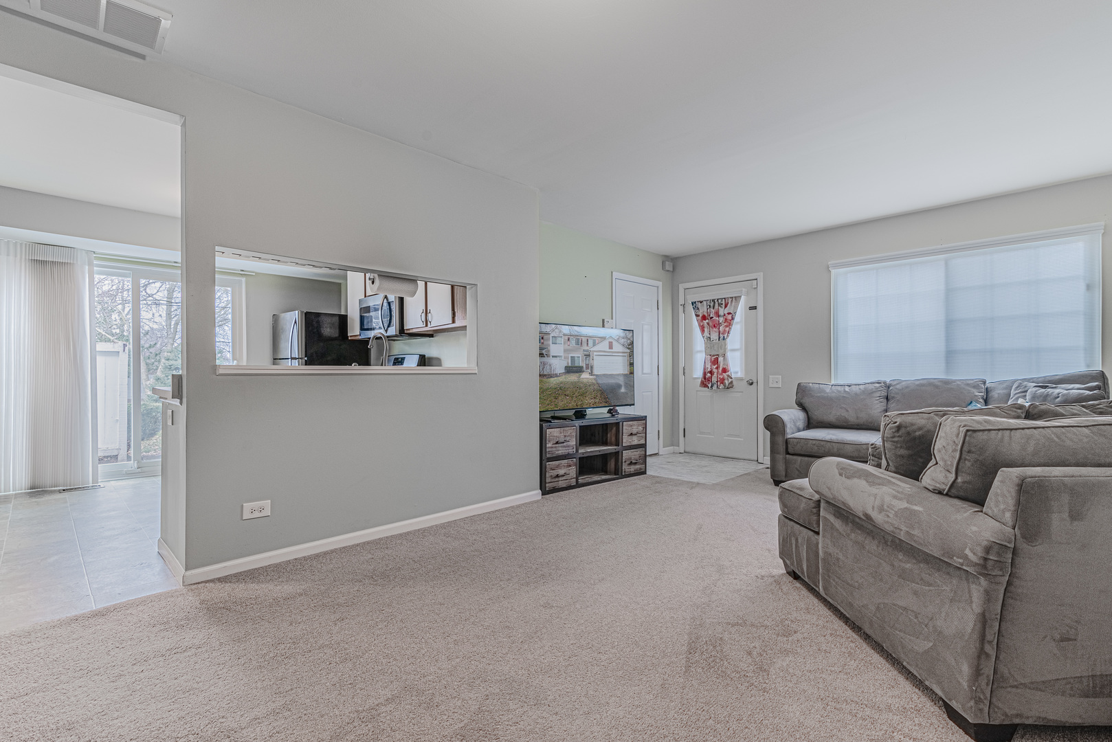 1516 Normantown Road Naperville, IL 60564 - Photo 5 of 20 a living room with furniture and a flat screen tv