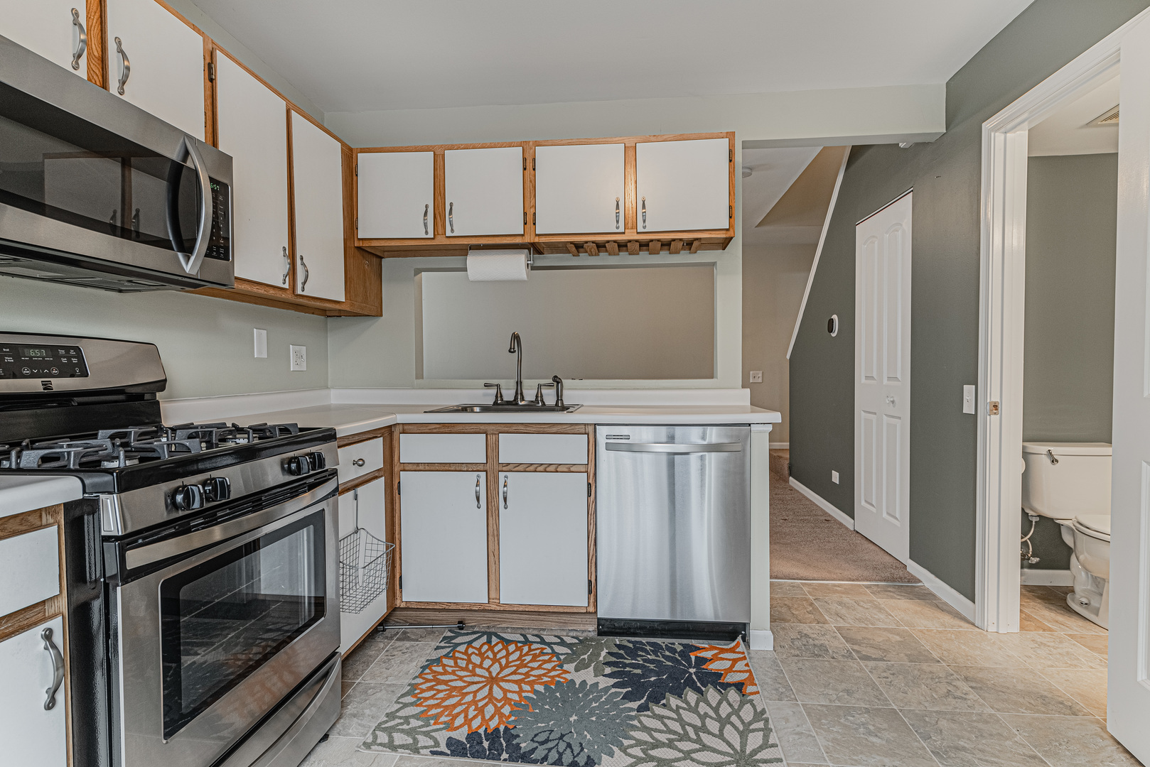 1516 Normantown Road Naperville, IL 60564 - Photo 7 of 20 a kitchen with stainless steel appliances granite countertop a stove a sink and a microwave