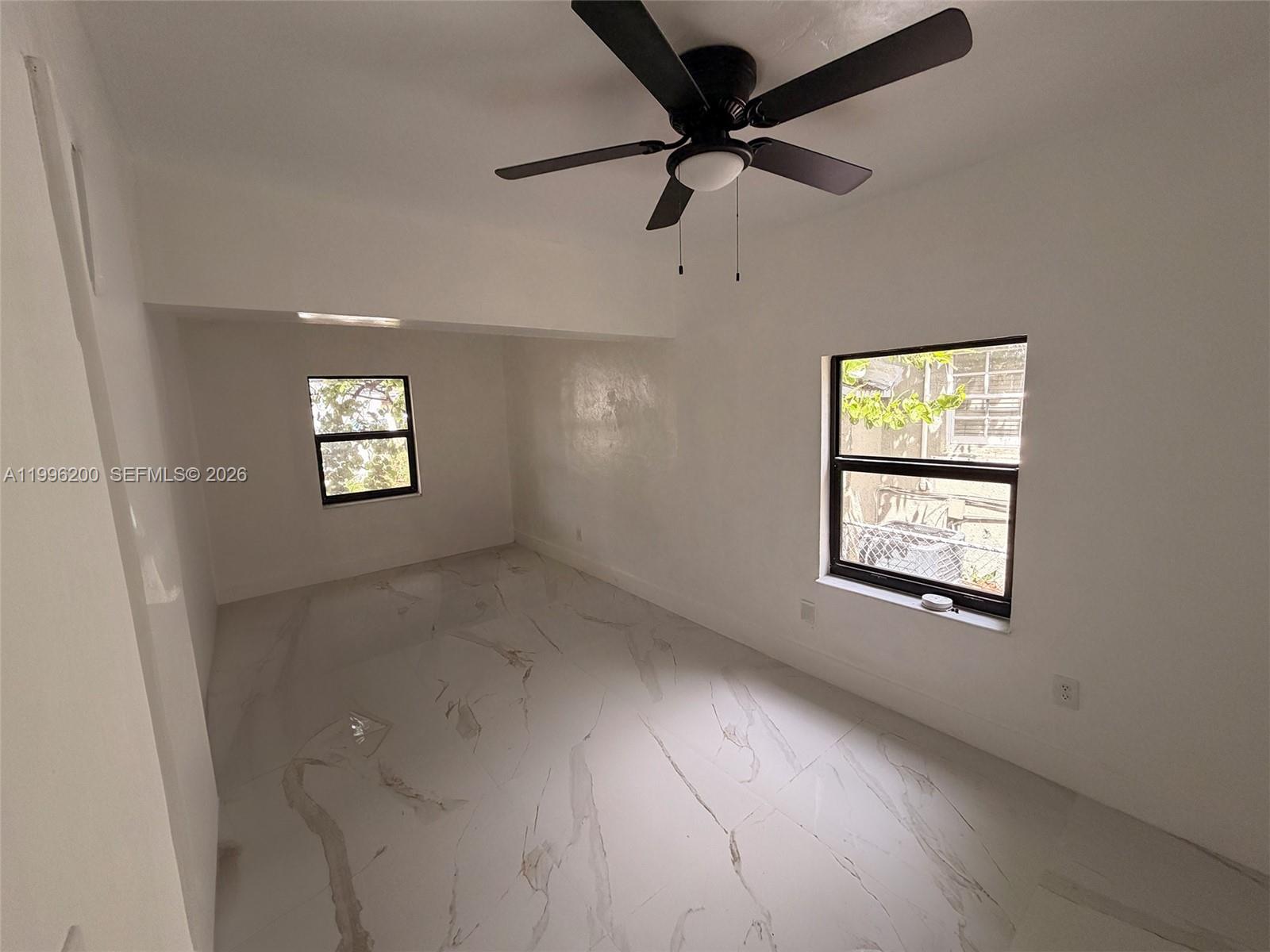 1261 Northwest 45th Street Miami, FL 33142 - Photo 44 of 95 a view of an empty room with a window