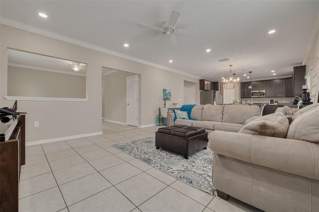 7242 Landmark Drive Spring Hill, FL 34606 - Photo 8 of 45 a living room with furniture and a couch