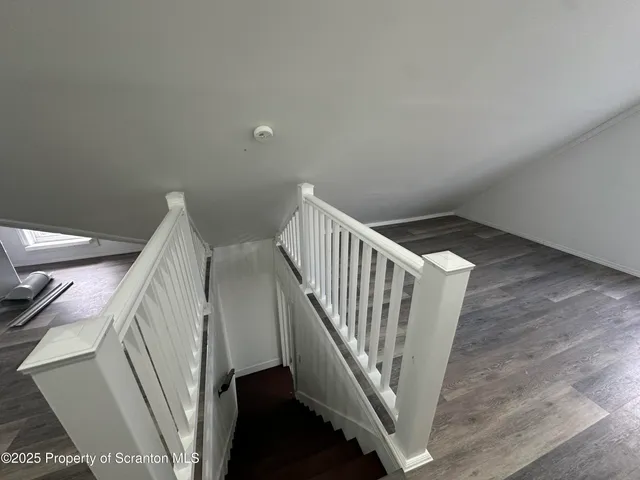 a view of a hallway with staircase