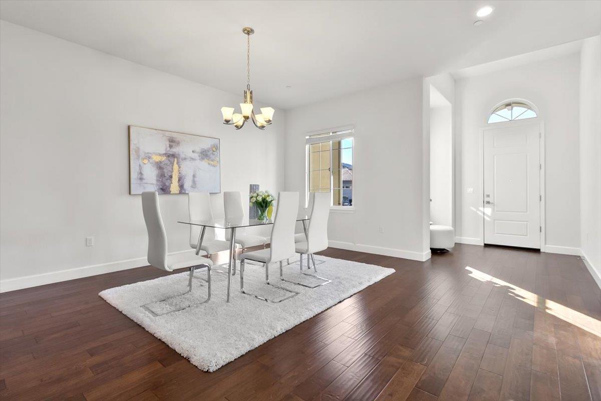 7842 Cinnamon Way Gilroy, CA 95020 - Photo 13 of 51 a view of a dining room with furniture and wooden floor