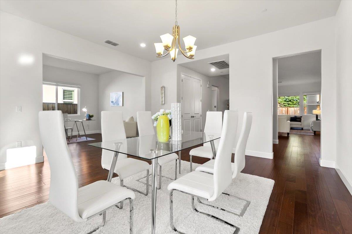 7842 Cinnamon Way Gilroy, CA 95020 - Photo 15 of 51 a view of a dining room with furniture and wooden floor