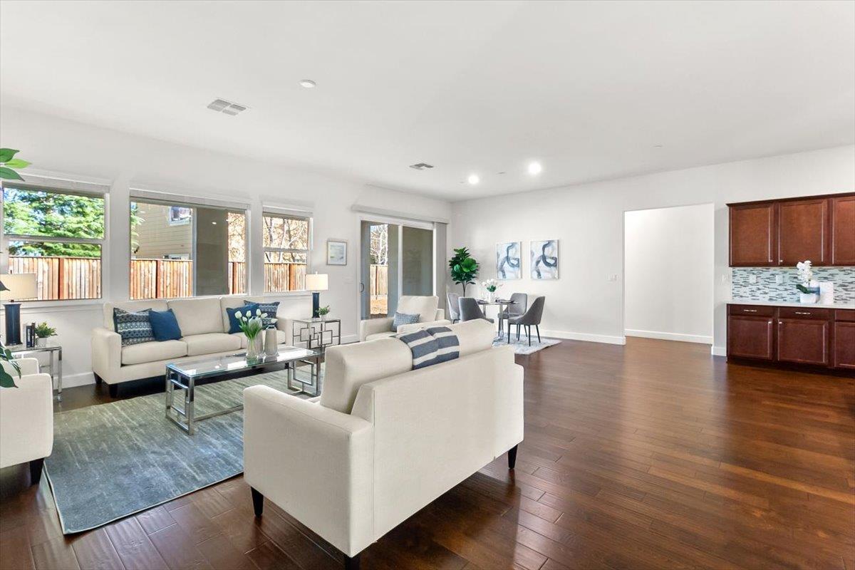 7842 Cinnamon Way Gilroy, CA 95020 - Photo 20 of 51 a living room with fireplace furniture and a wooden floor