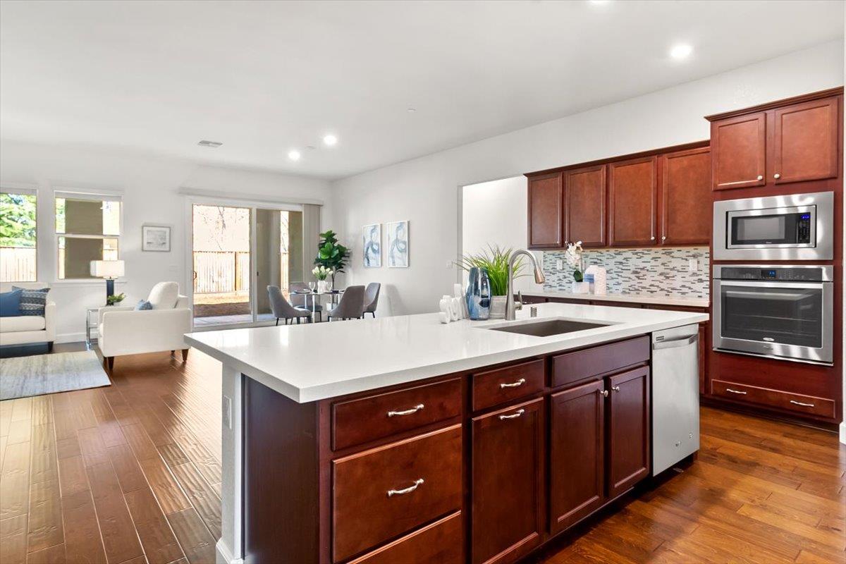 7842 Cinnamon Way Gilroy, CA 95020 - Photo 27 of 51 a kitchen with a sink appliances and cabinets