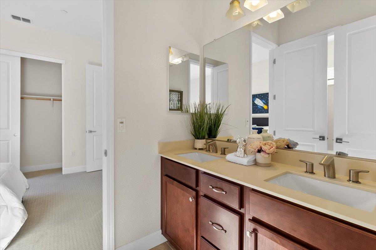 7842 Cinnamon Way Gilroy, CA 95020 - Photo 31 of 51 a bathroom with a sink and a mirror
