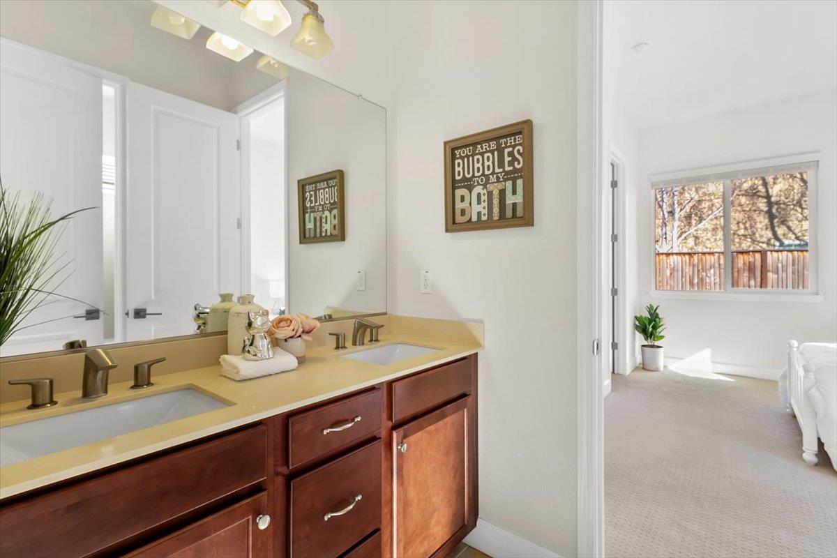 7842 Cinnamon Way Gilroy, CA 95020 - Photo 32 of 51 a spacious bathroom with a granite countertop sink mirror and a
