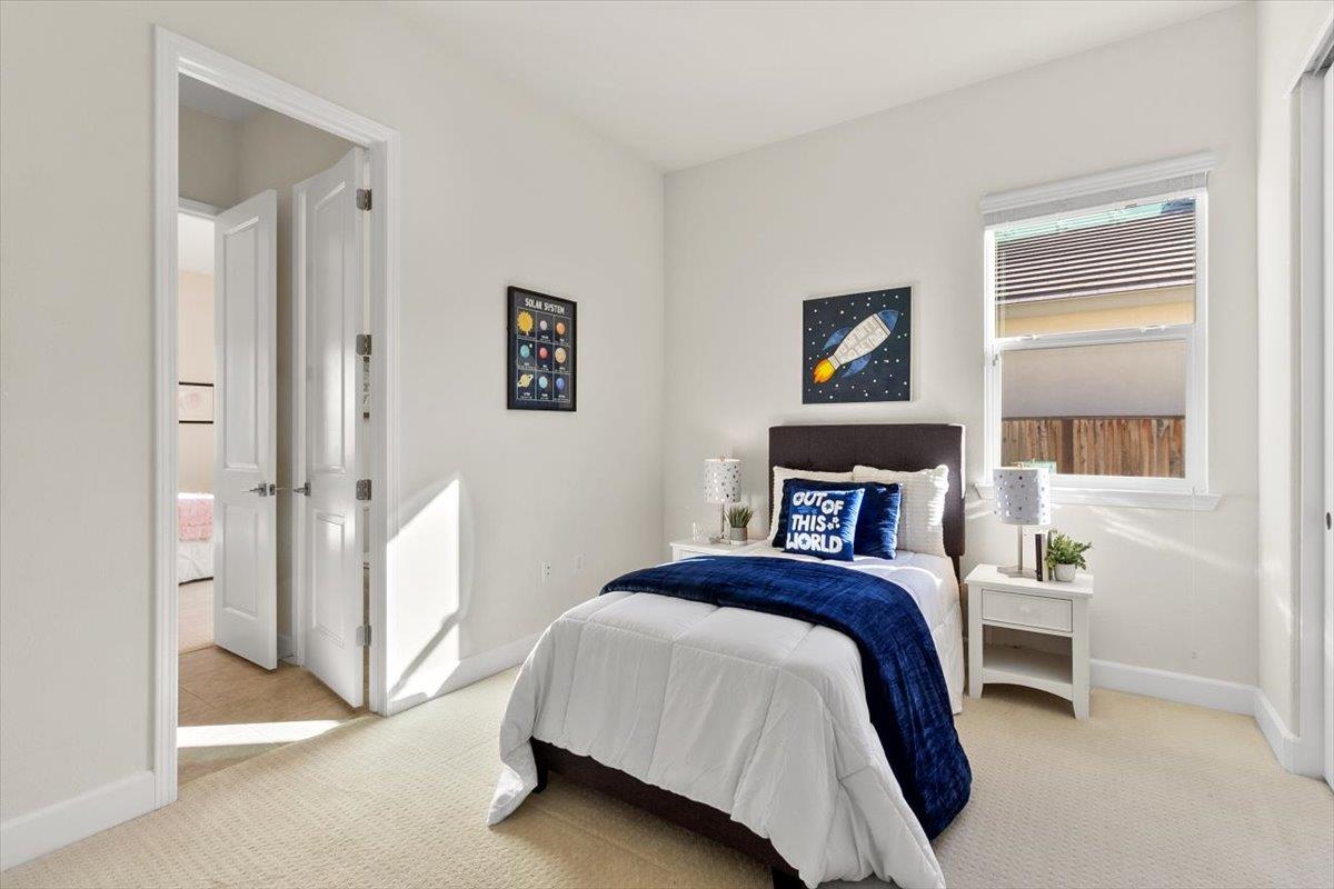 7842 Cinnamon Way Gilroy, CA 95020 - Photo 33 of 51 a bedroom with a bed and a window