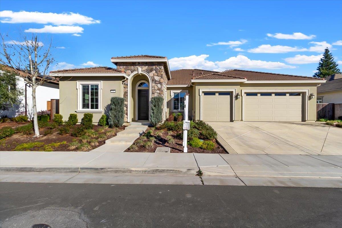7842 Cinnamon Way Gilroy, CA 95020 - Photo 4 of 51 front view of a house with a small yard
