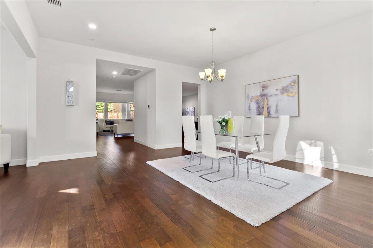 7842 Cinnamon Way Gilroy, CA 95020 - Photo 7 of 51 a view of a dining room with furniture and wooden floor