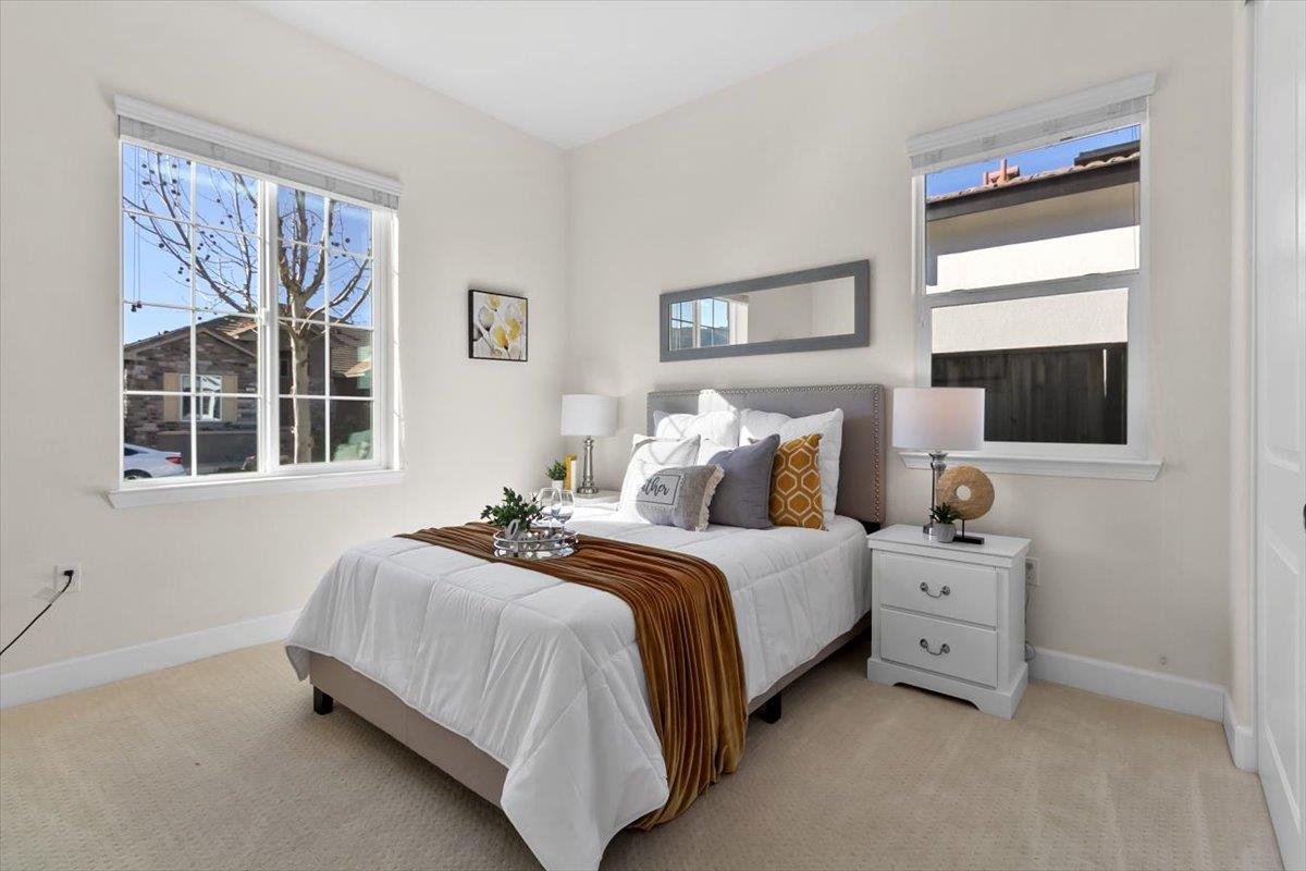 7842 Cinnamon Way Gilroy, CA 95020 - Photo 8 of 51 a bedroom with a bed and wooden floor