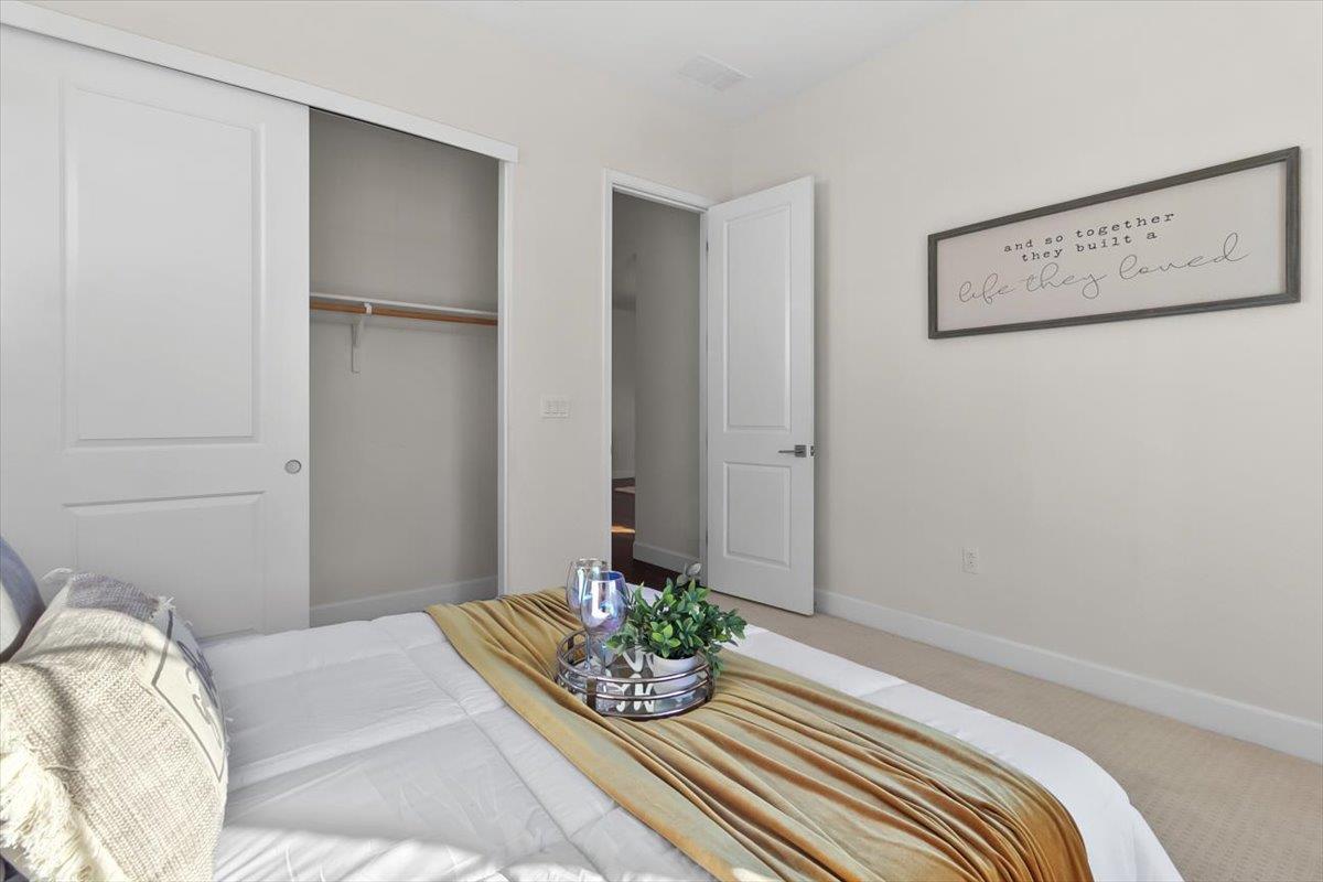 7842 Cinnamon Way Gilroy, CA 95020 - Photo 9 of 51 a bedroom with a bed and painting on the wall