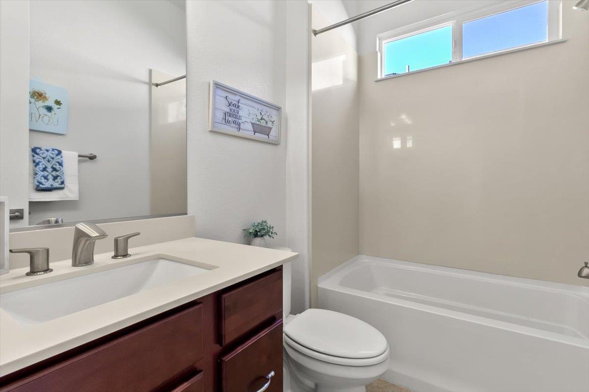7842 Cinnamon Way Gilroy, CA 95020 - Photo 10 of 51 a bathroom with a sink a toilet and shower