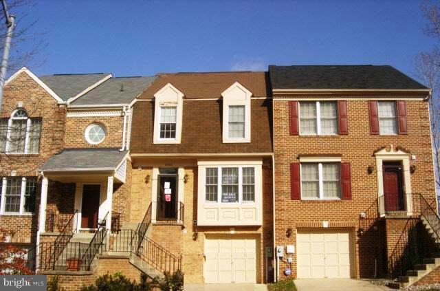 12103 Apache Tears Circle Laurel, MD 20708 - Photo 1 of 11 a front view of a house with a glass windows