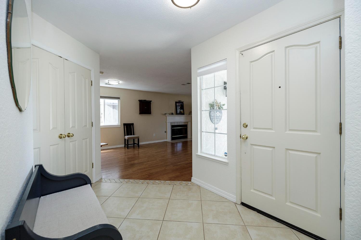 230 Meyenberg Avenue Ripon, CA 95366 - Photo 8 of 52 a living room with furniture and a table