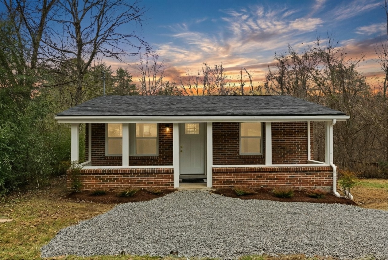 front view of a house with a yard