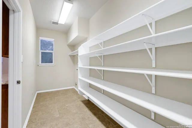 a view of an empty walk in closet