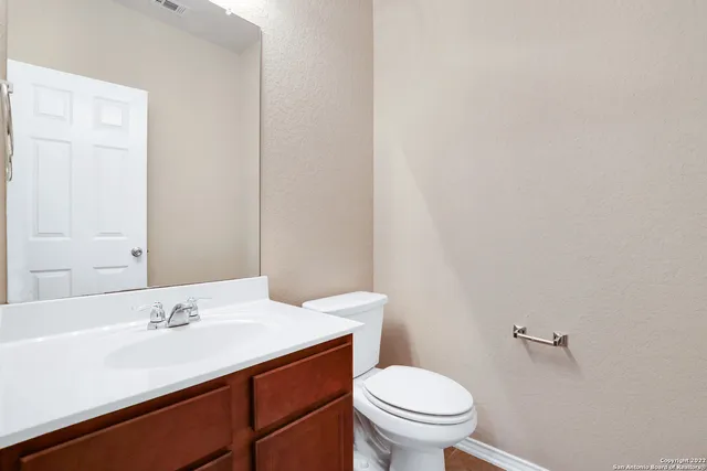 a bathroom with a sink and a toilet