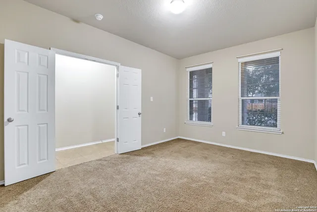 an empty room with windows