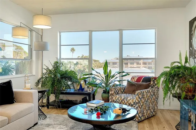 a kitchen with stainless steel appliances granite countertop a sink a stove and cabinets