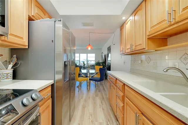 a large bed sitting in a bedroom next to a window