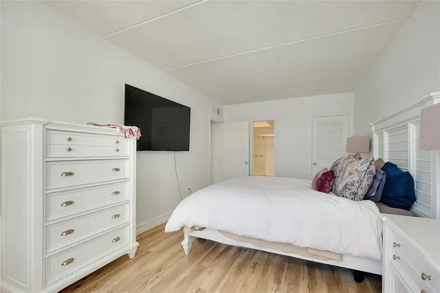 a bathroom with a shower a toilet and a sink