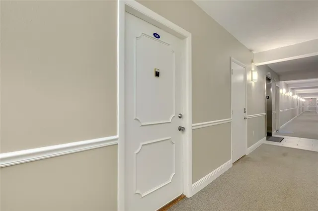 a view of a porch with furniture and a potted plant