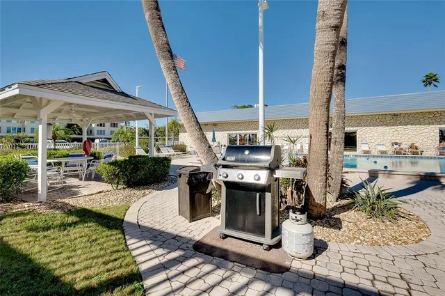 a view of a swimming pool with a yard