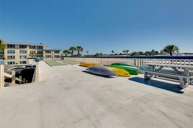 a picture of a city with lots of buildings and ocean view