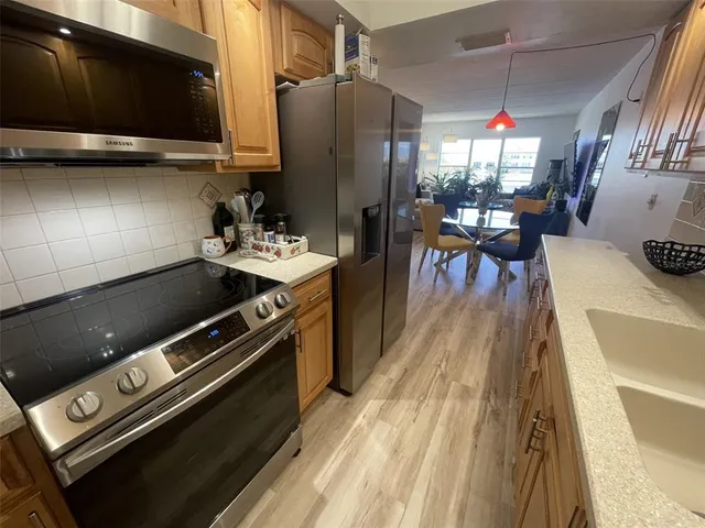 a kitchen with a stove and a microwave