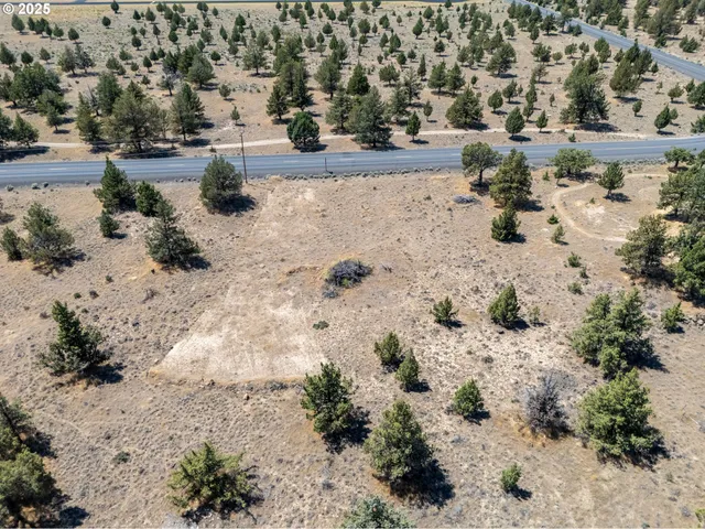 an aerial view of house with a yard