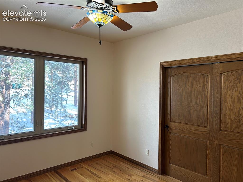 17990 Sawmill Road Colorado Springs, CO 80908 - Photo 15 of 40 Second bedroom (or office) on main level