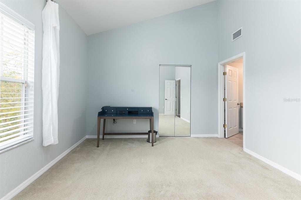 4850 Southwest 91 Terrace, Unit 301 Gainesville, FL 32608 - Photo 11 of 24 a view of an empty room with a window