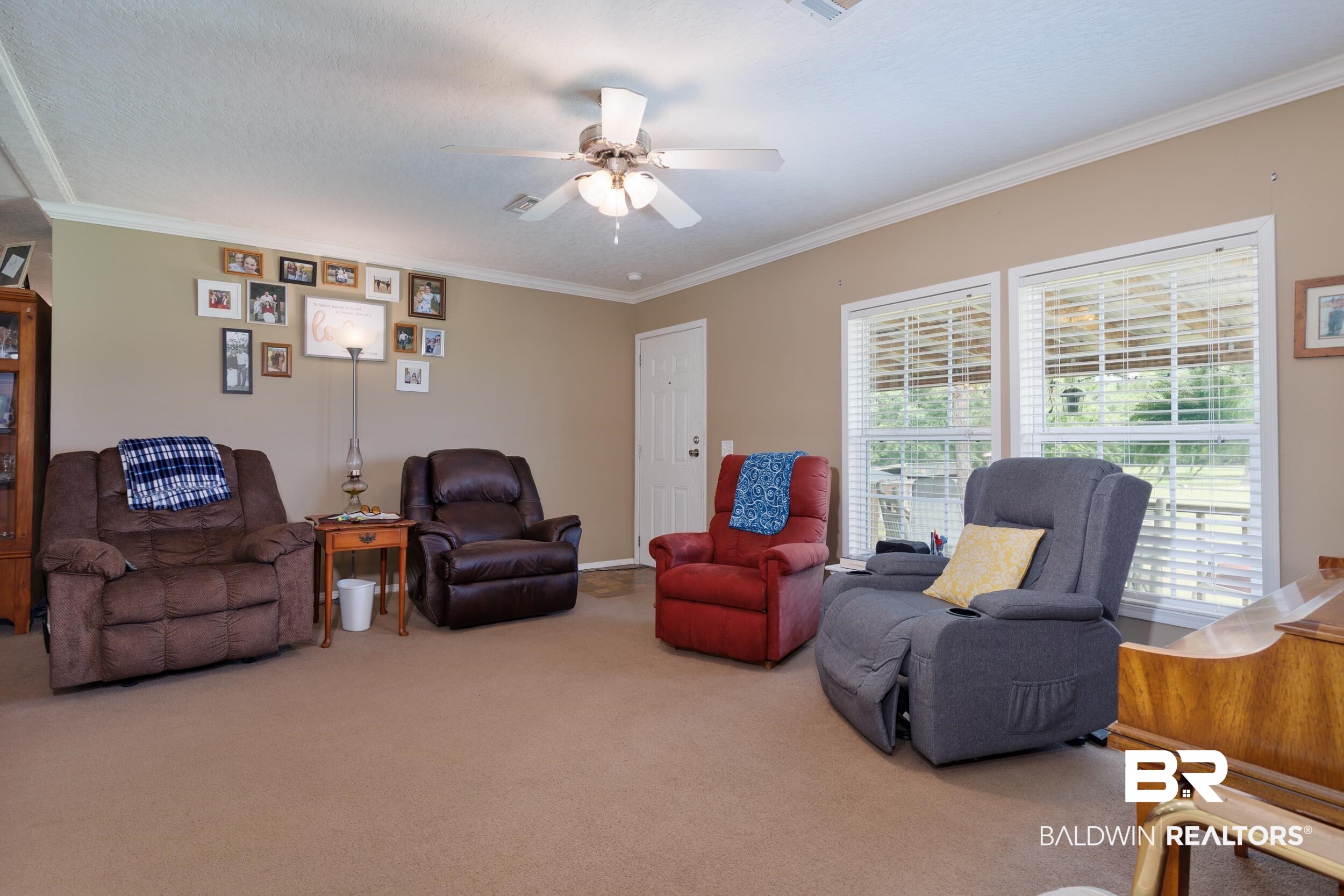 6725 Upper Creek Road Flomaton, AL 36441 - Photo 34 of 61 Carpeted living area featuring ornamental molding and ceiling fan