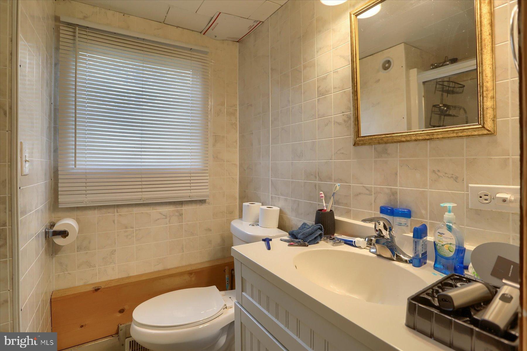 207 Mill Race Road Millerstown, PA 17062 - Photo 12 of 34 a bathroom with a sink a toilet and shower