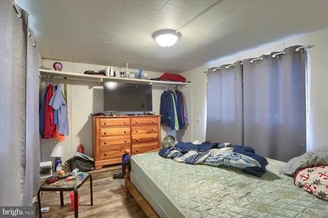 a bedroom with a bed and a closet