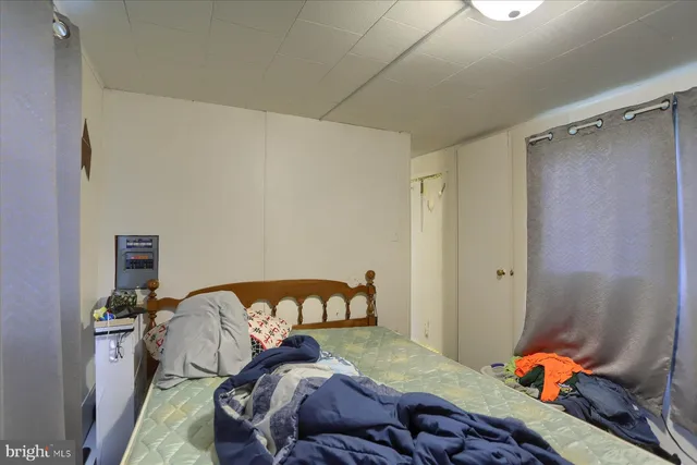 a bedroom with a bed and a closet