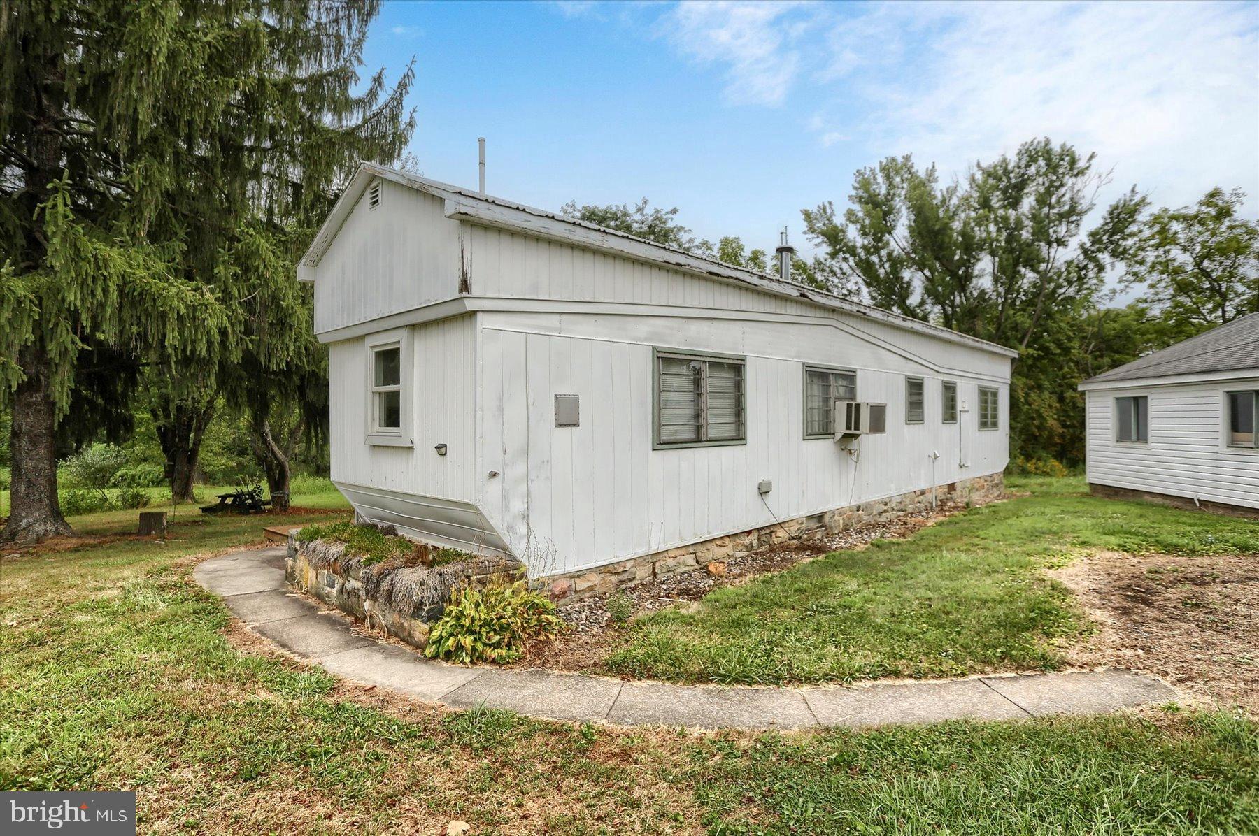 207 Mill Race Road Millerstown, PA 17062 - Photo 20 of 34 front view of a house with a yard