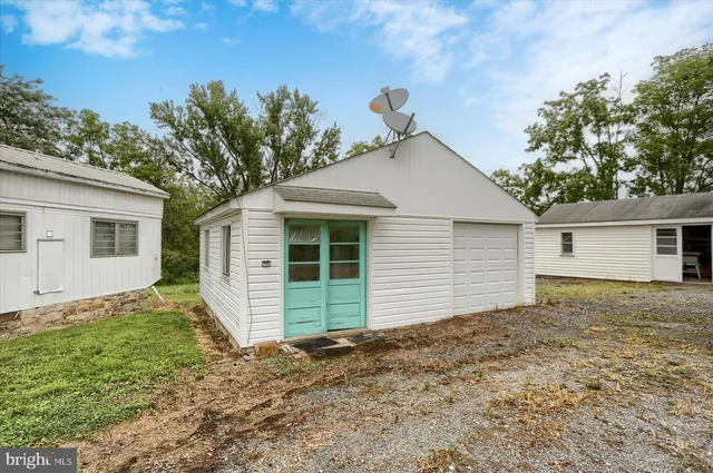 a view of a house with a yard and garage